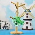 Funny green watermelon shark plush keychain with teeth hanging on a wooden display stand - Watermelon Shark (Lobster Clasp) / 10cm