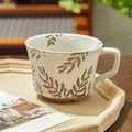 Hand-painted ceramic mug with brown leaf pattern and large square handle in cream finish - Willow Leaf