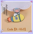 Cute astronaut pig riding a rocket acrylic brooch with up symbol in yellow and blue - Flying Pig