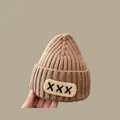 Thick knit dark camel winter hat for kids with ribbed texture and letter patch - 2 Months-2 Years / XXX Baby Hat Khaki