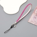 Detail of pink rhinestone phone strap with white leather backing and silver metal clasp - Wrist Strap / Rose Red