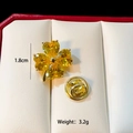 Detail of golden clover brooch with heart gemstone in gift box, 1.8cm size and 3.2g weight - Yellow Clover (C293)