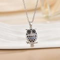 Elegant owl necklace with black and blue crystals on a polished silver chain pendant - Silver Hollow Owl/Blue Black Eye