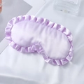 Lavender silk satin sleep mask featuring ruffled lace edges and elastic headband - Lavender