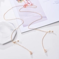 Golden eyewear chain with sparkling rhinestone pendant and non-slip silicone loops - Round / Gold