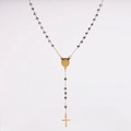 Detailed view of black faceted rosary beads with gold cross and holy medal on white background - Silver Gray