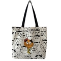 Detailed close-up of cute cat illustrations on white canvas tote bag with black handles - Beige Orange Cat