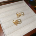 Detail of elegant gold fishtail leaf earrings with white pearls in a velvet jewelry box - Ear Hook - Gold