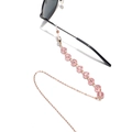 Close-up of pink crystal beads and gold metal chain for glasses with anti-slip rubber loops - Pink