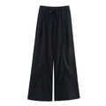 Detail of black wide-leg linen trousers with elastic drawstring waistband and fluid texture - XS / Pants / Black