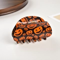 Macro detail of Halloween shark clip showing orange pumpkin patterns on black resin - Pumpkin Pattern / 8.2cm
