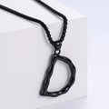 Polished black fluid style letter D pendant necklace on a white minimalist stone base - Letter D (Black With Chain)