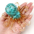 Resin octopus figurine with turquoise stones and gold flakes on a white background - Blue Turquoise (Synthetic)