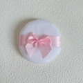 Close-up of a round white velvet makeup puff with a delicate pink satin bow decoration - Bulk Packaging / Large (70*18MM)