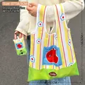 Foldable grocery bag with yellow stripes and red apple print, portable shopping tote - Green Spring Apple