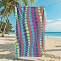 Microfiber beach towel with colorful polka dots hanging between palm trees on a tropical beach - 80*160cm / Multicolor Polka Dot