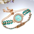 Luxury rose gold watch with emerald stones and a radiant lake blue quartz dial - Green