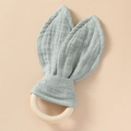 Detail of mint green cotton muslin bunny ears on a natural wooden ring baby teether - Dark Gray