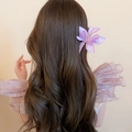 Detailed view of a purple fabric hibiscus flower hair clip on wavy brown hair - 32# Duckbill Clip - Purple - 3D Silk Fabric Purple Single