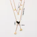 Detail view of double-layer stainless steel heart necklace with sizes 35cm and 40+5cm - Gold Double Layer Y-Shape Black & White Hearts