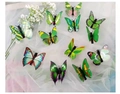 Set of 11 colorful butterfly hair clips in vibrant green tones on white soft fabric - Green Hair Clip