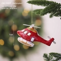 Christmas tree ornament featuring a red helicopter design with golden hanging string - Airplane