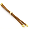 Detail of adjustable brown braided rope cord with gold metal slider for DIY jewelry - Tan