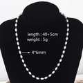 Detailed view of the 4x6mm pearl necklace with 40+5cm gold-toned stainless steel chain - Rice Pearl Necklace (4x6mm)