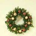 Christmas wreath with green pine needles, gold berries, and ornaments on a plain wall - 50cm Christmas Wreath (Original)