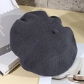 Minimalist dark grey wool-like beret hat with classic texture on vintage books - One Size / Dark Gray