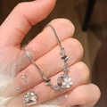 Elegant silver bracelet with butterfly and flower charms featuring zircon accents and adjustable chain - S274 Silver