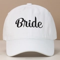 Detailed view of white cotton baseball cap with elegant black Bride embroidery texture - BRIDE / White