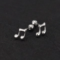Detailed view of silver musical note stud earrings with secure screw ball backing - Music Note / Steel