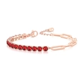 Detail of rose gold tennis bracelet featuring red zircons and paperclip chain links - 4mm Rose Gold Red Stone