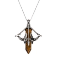 Macro detail of retro silver arrow pendant with natural tiger eye hexagonal stone - Yellow-Brown (Tiger Eye)