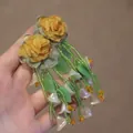 Detail of floral earrings with yellow cloth roses and green beaded tassels with leaf charms - 925 Sterling Silver Earring Post Green Orange Flower Tassel (8#)