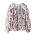 Close-up of V-neck floral blouse with ruffled layers and delicate button closure - Pink Marble Pattern