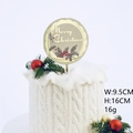 Golden acrylic Merry Christmas cake topper with holly leaf design in a festive setting - Gold