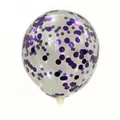 Macro view of transparent latex balloon filled with purple round sequins for party decor - Glitter Purple