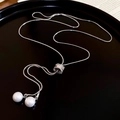 Close-up of silver snake chain necklace with dual white pearls and zircon accents - Silver
