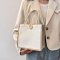 Chic summer handbag for women featuring white floral embroidery and brown woven jute handles - Off-white