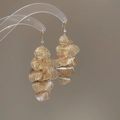 Detail of gold petal tassel earrings with brushed texture and small crystal on ear hook - Rhinestone Radial Pattern Ear Hook (6#) / Gold