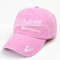 Close-up of pink washed cotton baseball cap with New Orleans jazz themed embroidery - Pink