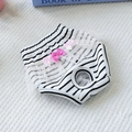 Close-up of black and white striped dog diaper with pink bows and white lace trim - Black & White Stripes