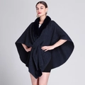 Navy blue knitted poncho cape with elegant black faux fur collar and pom-pom details - Navy Blue