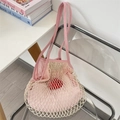 Detail of summer mesh tote bag with pink fabric lining and cream woven outer layer - Pink