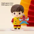 Traditional Chinese boy doll figurine in yellow tang suit holding a fish kite cake topper - PVC Boy with Kite