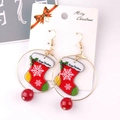 Christmas stocking earrings with snowflake pattern and red bead on a white display card - Hoop Christmas Sock