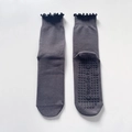 Grey yoga socks with ruffled cuffs and anti-slip grips on a white background - One Size / Dark Gray