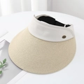 Detail of beige straw brim and white canvas headpiece with a small metallic logo - Beige